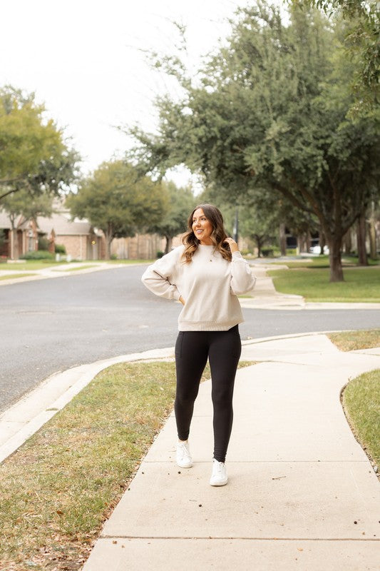 Woman walking on a sidewalk in a residential area