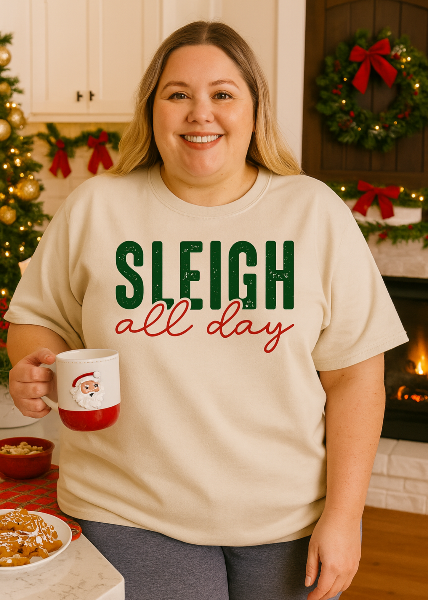 white tee with words sleigh all day on a plus size model
