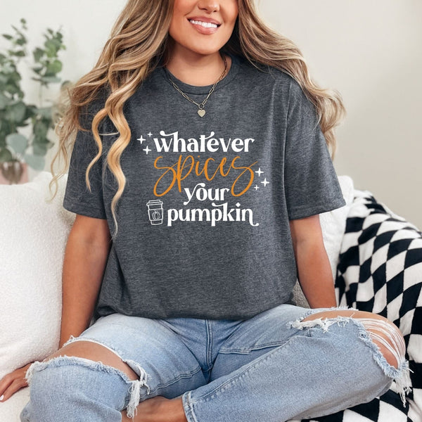Person wearing a dark gray t-shirt with a humorous pumpkin spice quote, sitting on a couch.