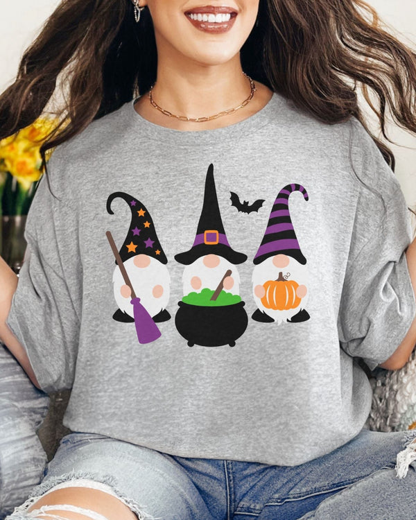 Woman wearing a gray t-shirt with Halloween-themed gnomes design.