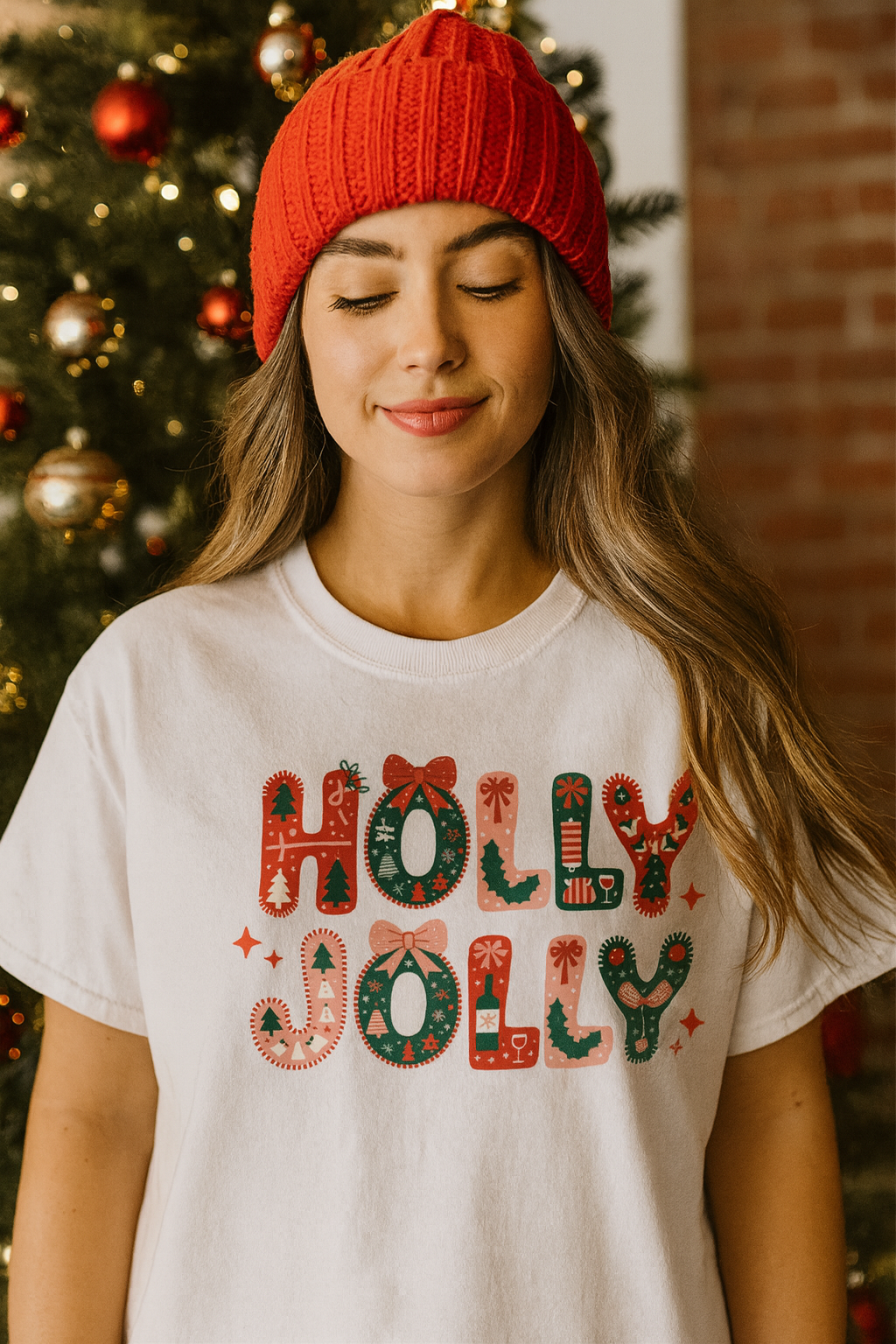 Woman wearing a 'Holly Jolly' shirt with a Christmas tree in the background