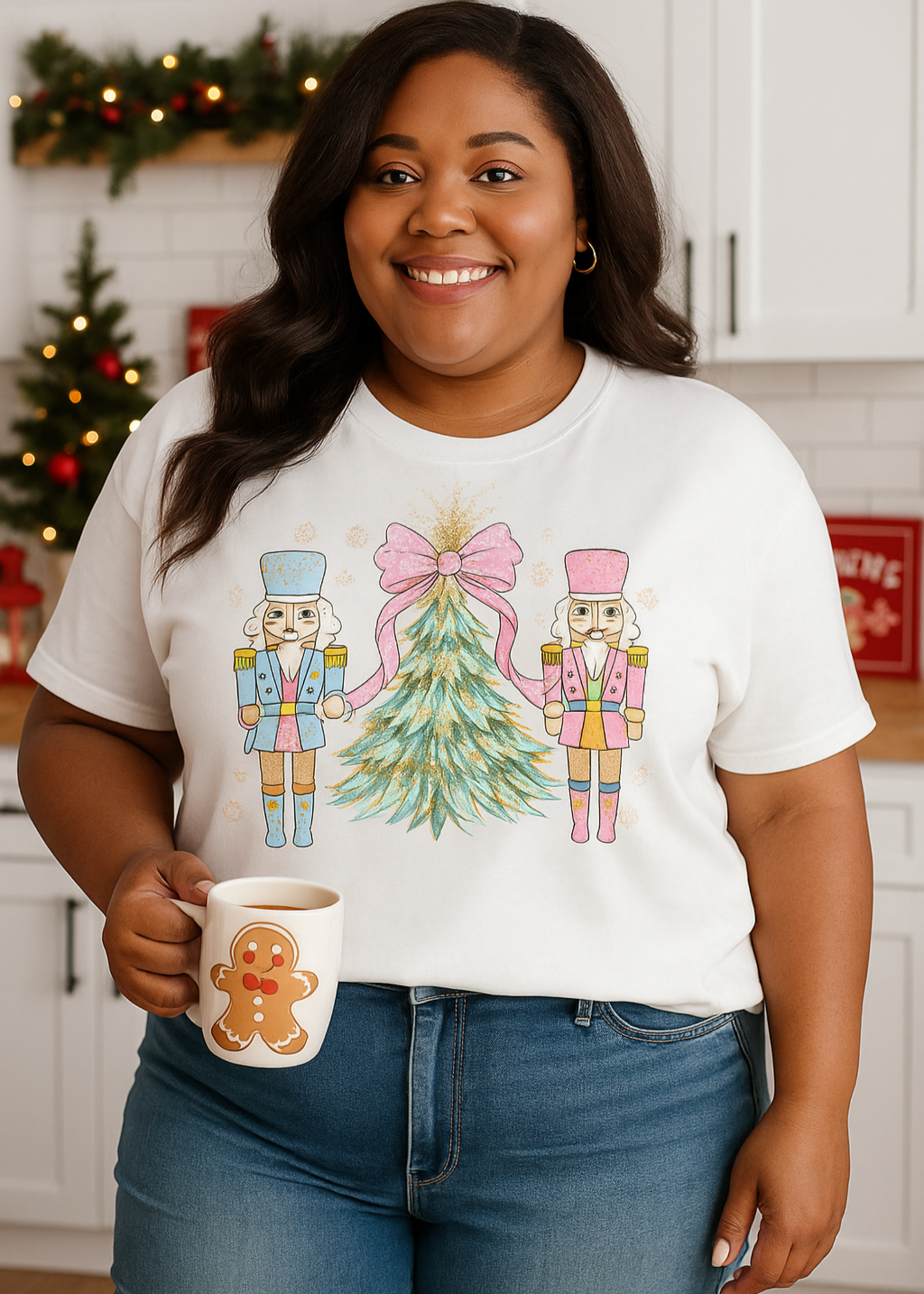 Person wearing a white t-shirt with a Christmas design, holding a mug in a kitchen.