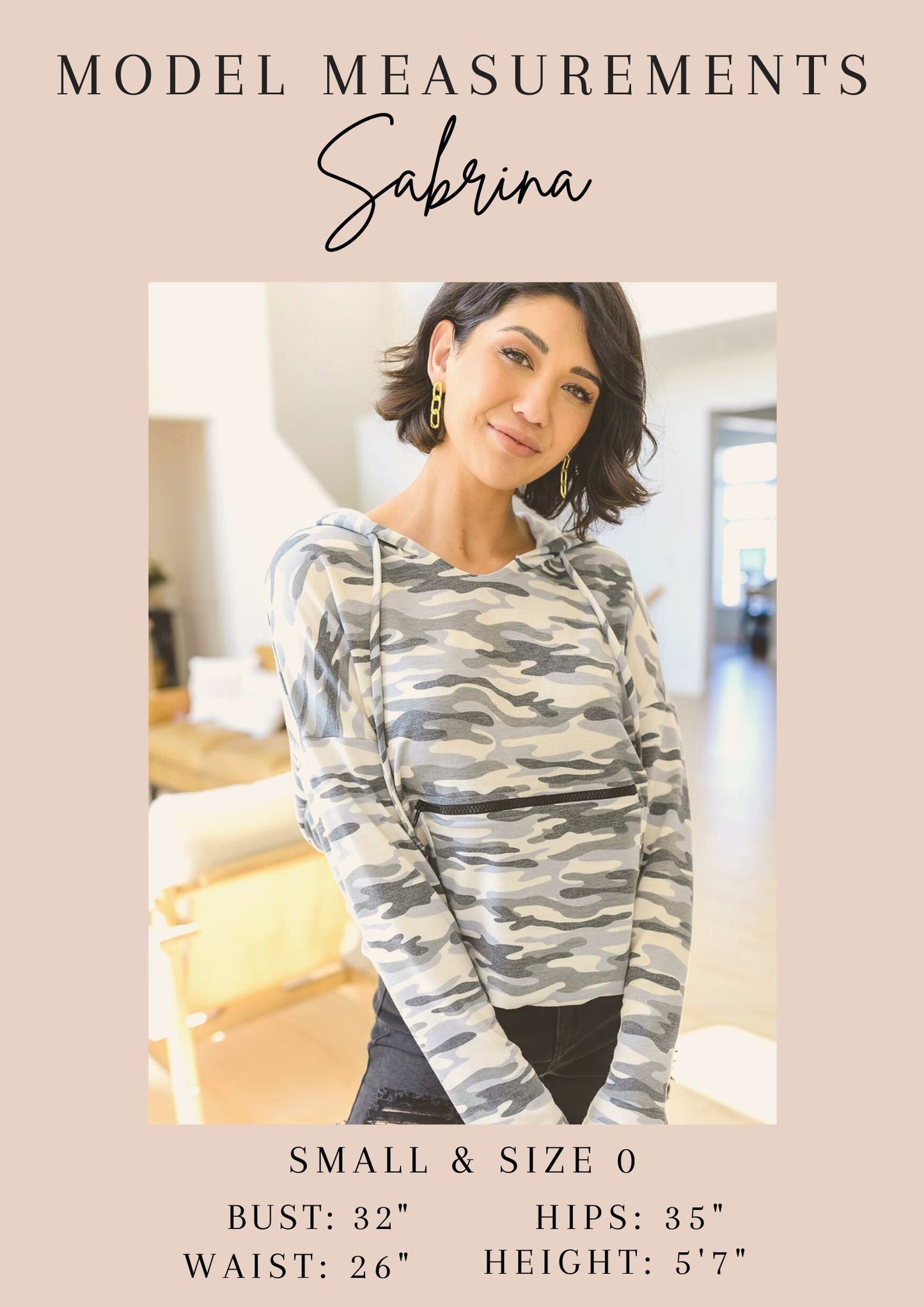 Woman wearing a camouflage long-sleeve top with model measurements displayed.