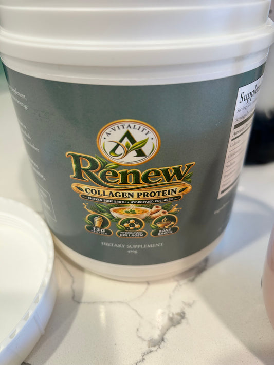 A white plastic tub of Av Vitality Renew Collagen Protein dietary supplement, featuring a dark green label with gold and white text, set on a white marble countertop.
