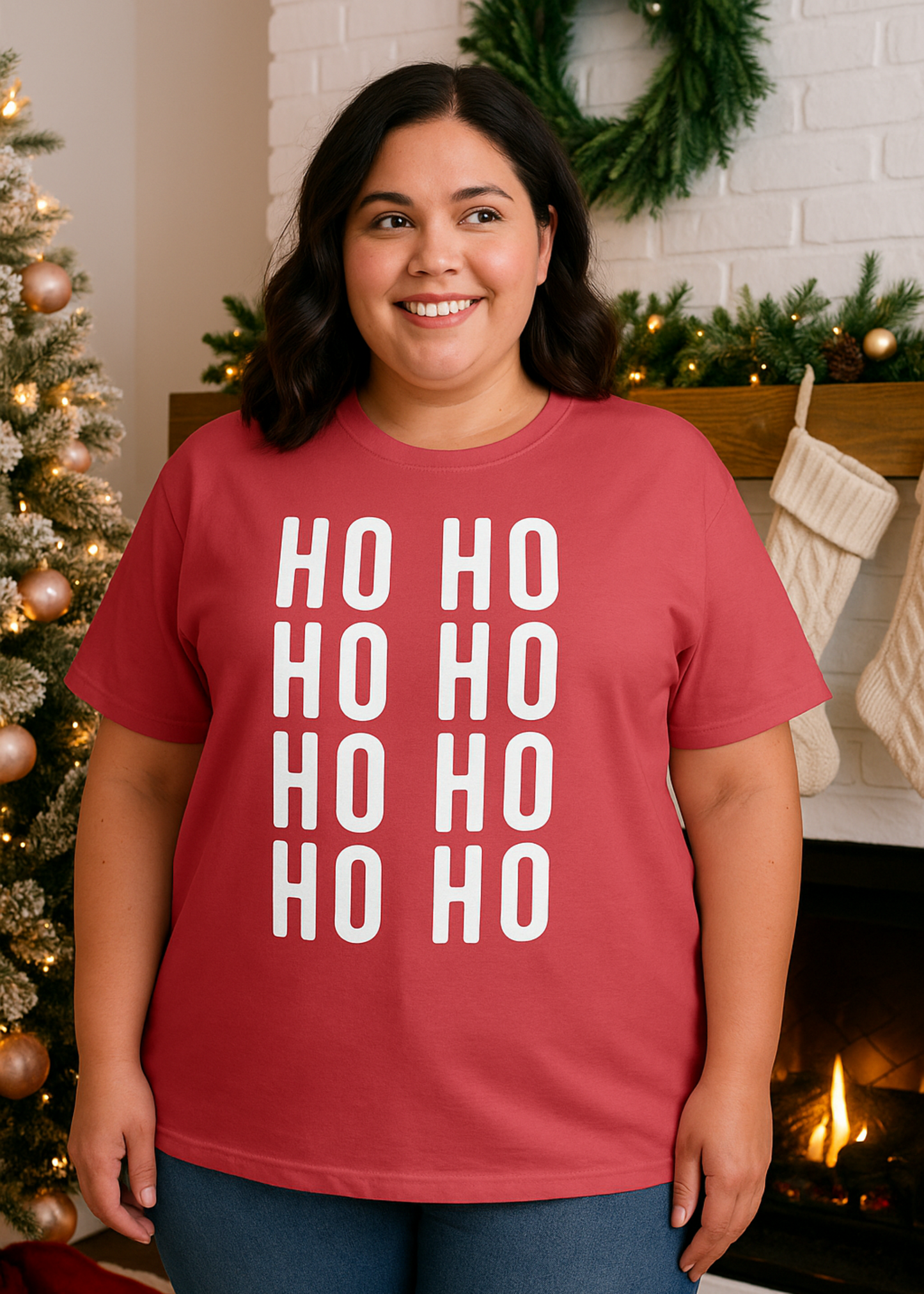 Person wearing a red 'HO HO HO' shirt in a festive setting with a Christmas tree and fireplace.