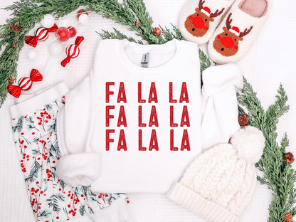 Christmas-themed outfit with 'FA LA LA' text, reindeer hats, and festive decorations on a white background.