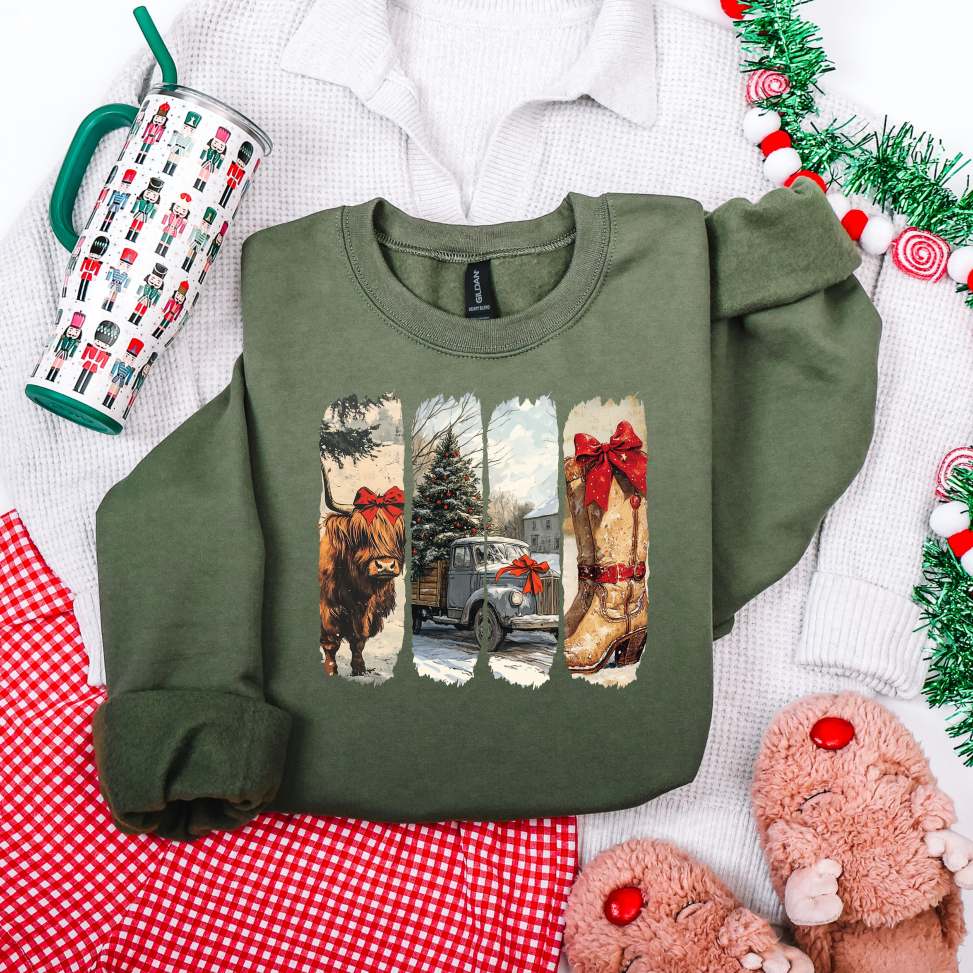 Green sweatshirt with festive design on a white surface with Christmas decor