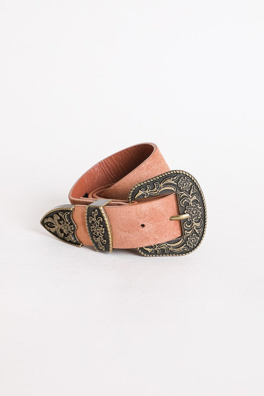 Pink belt with decorative buckle on a white background