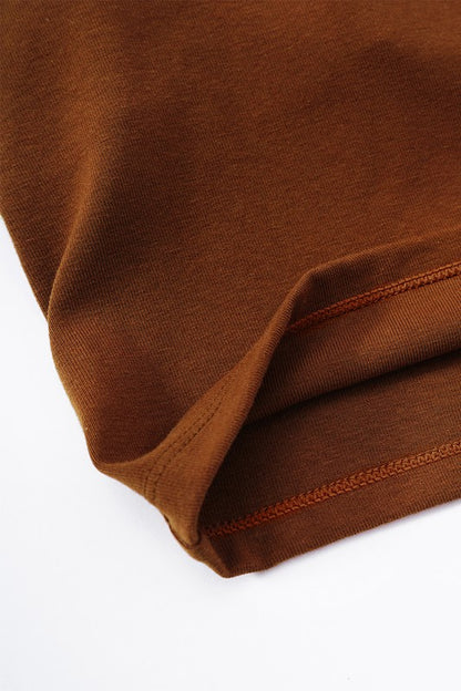 Close-up of brown fabric with a white background