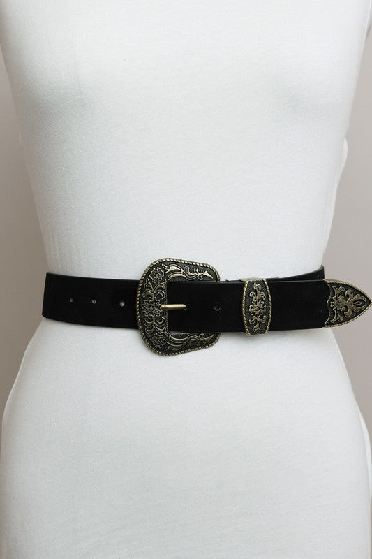Black belt with decorative buckle on a mannequin against a white background