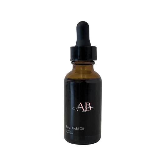Amber glass dropper bottle with black cap on a white background