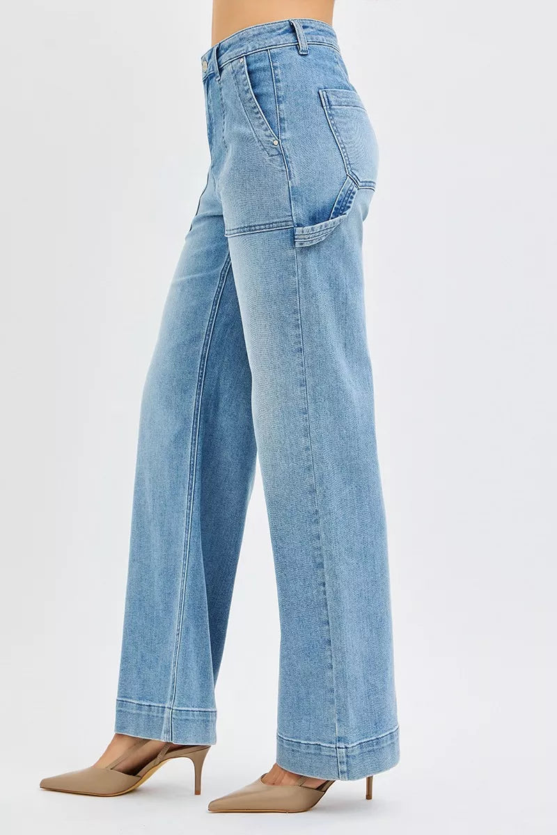 Light blue jeans worn by a person on a white background