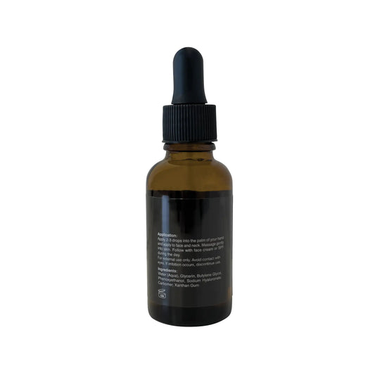 Brown glass dropper bottle with black cap on a white background