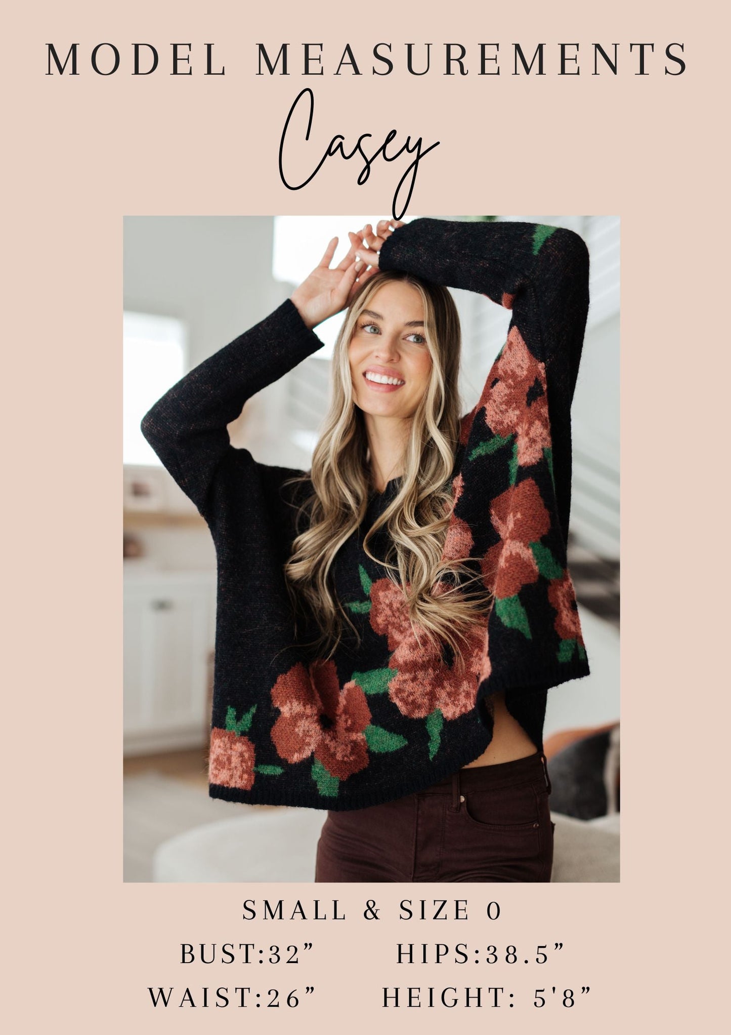 Woman wearing a floral sweater with model measurements displayed.