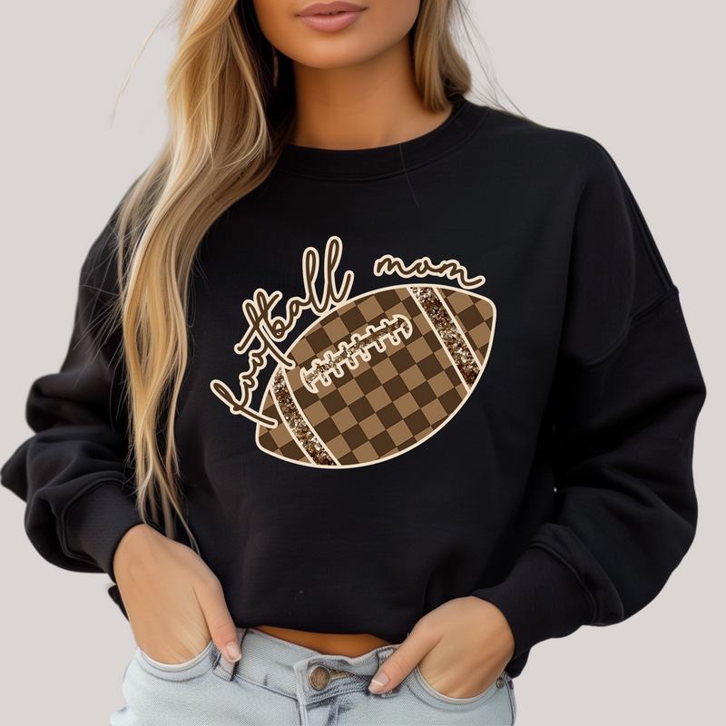 Black sweatshirt with football graphic and 'Football mom' text on a plain background