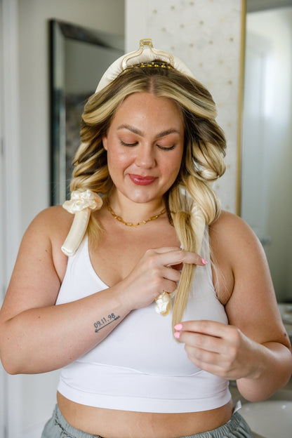 Woman with styled hair in a bathroom setting