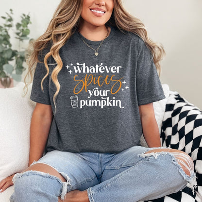 Person wearing a dark gray t-shirt with a humorous pumpkin spice quote, sitting on a couch.