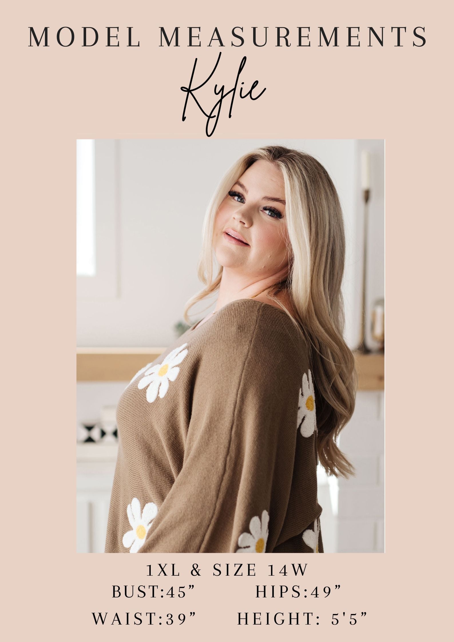 Woman wearing a brown cardigan with white floral patterns, standing indoors.