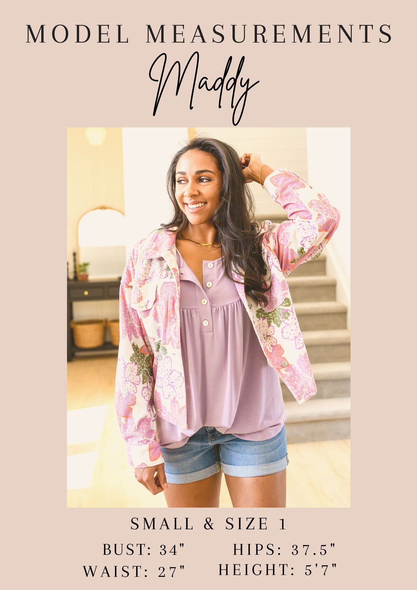 Woman wearing a pink floral jacket over a pink top and denim shorts, with model measurements displayed.