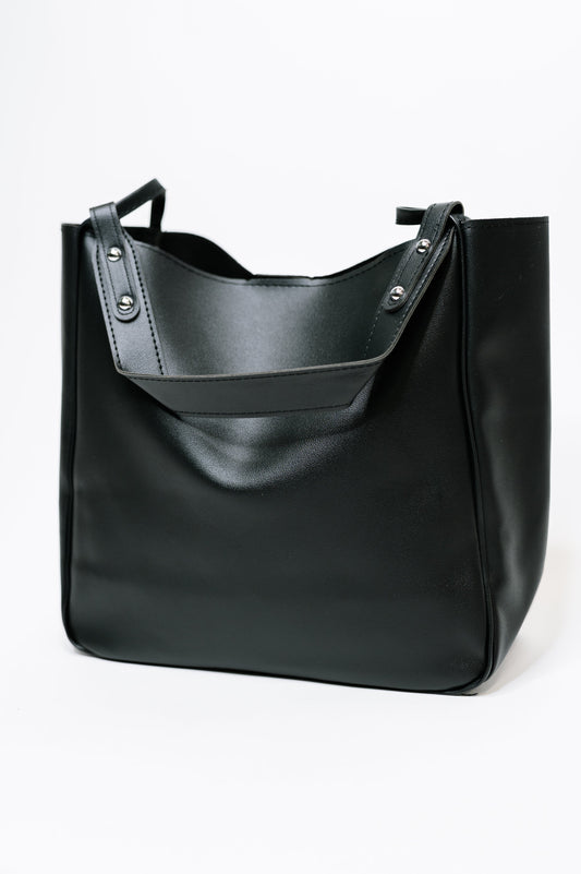Black leather tote bag on a white background