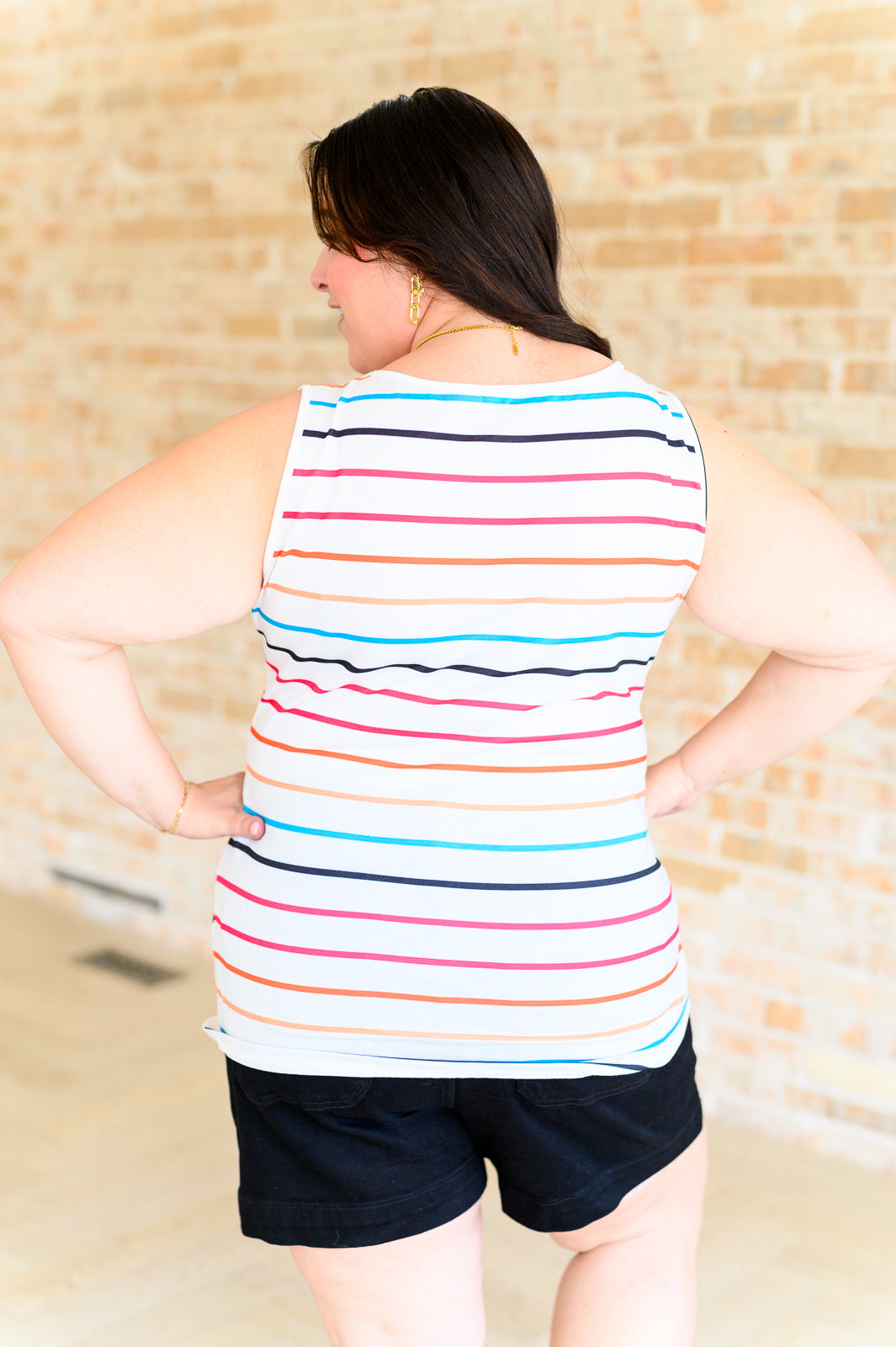 colorful striped henley tank top with a scoop neckline and a functional button closure.
