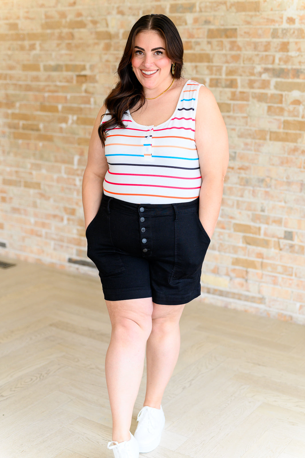 colorful striped henley tank top with a scoop neckline and a functional button closure.