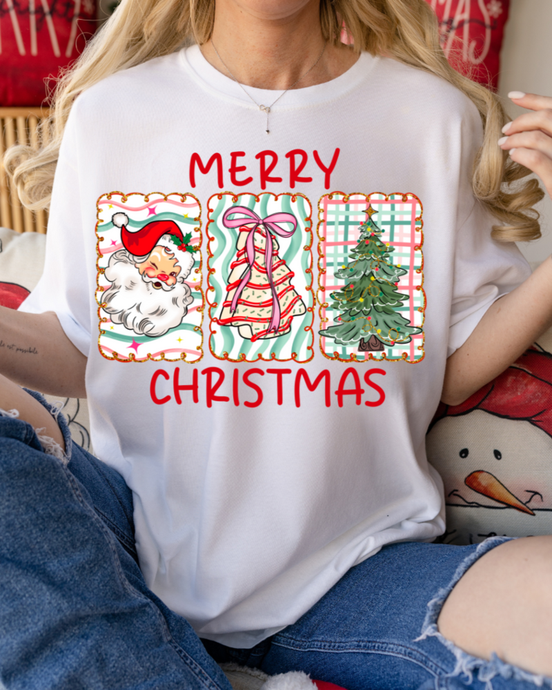 Person wearing a white t-shirt with Christmas-themed graphics and text.