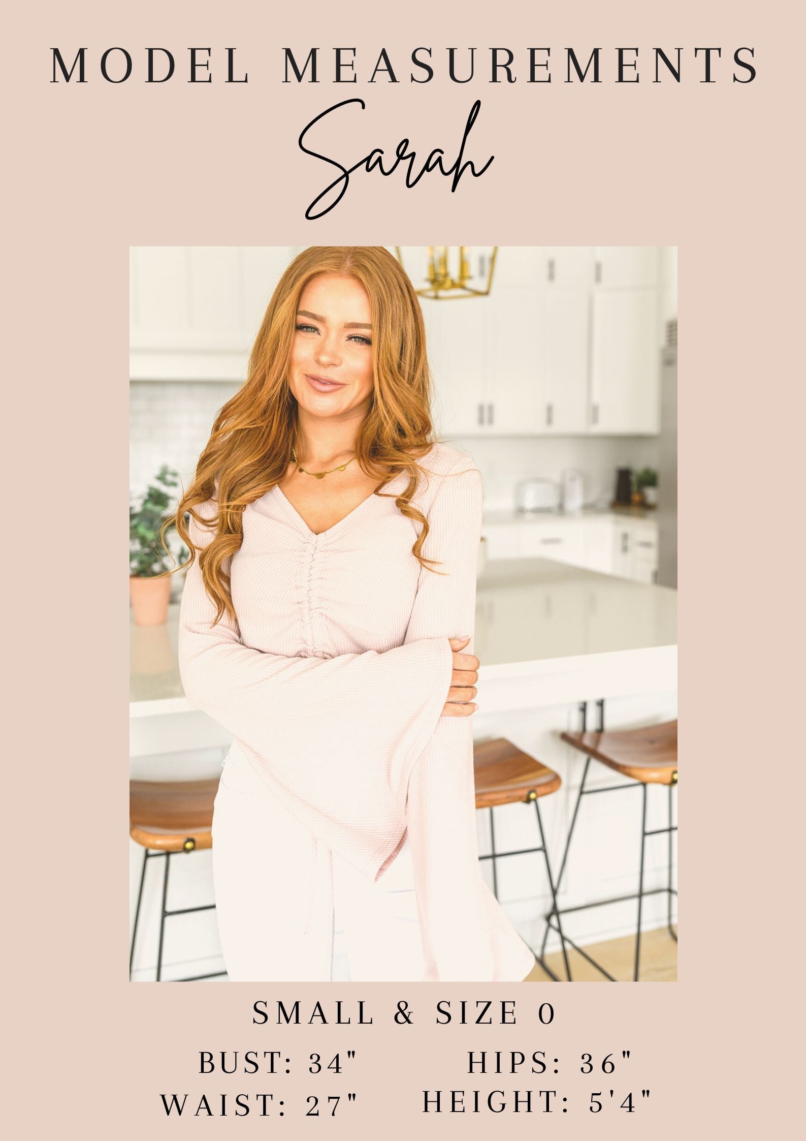 Woman in a pink dress sitting in a kitchen, with model measurements displayed below.