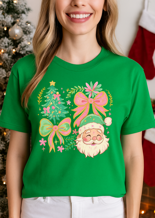 Person wearing a green t-shirt with a Christmas-themed design featuring a gnome, trees, and bows.
