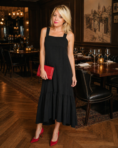 black maxi dress inside a nice resturant with red heels & red purse