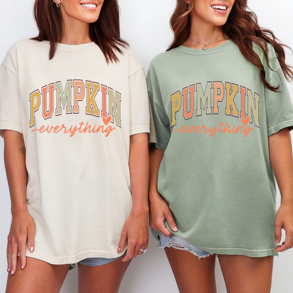 Two women wearing 'Pumpkin everything' t-shirts on a plain background