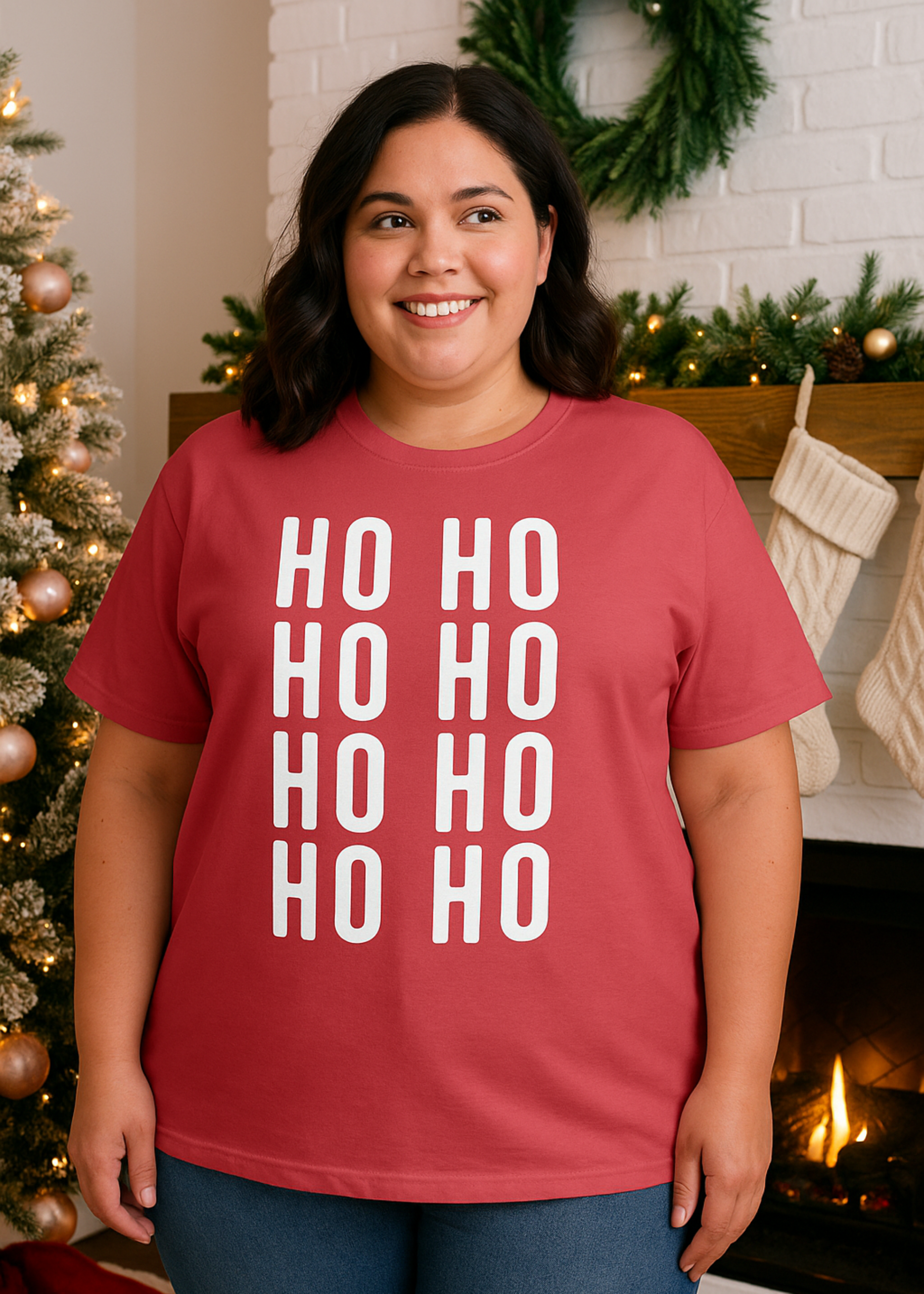 Person wearing a red 'HO HO HO' shirt in a festive setting with a Christmas tree and fireplace.